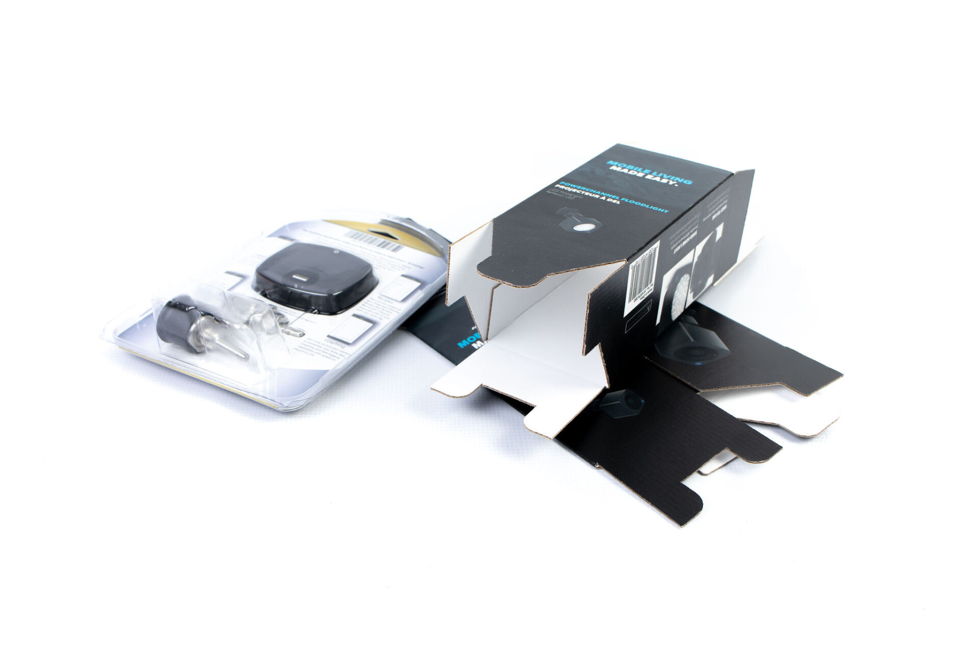 cardboard box and product in clear plastic packaging